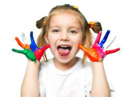 Young girl showing her painted hands